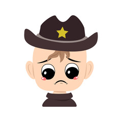 Boy with crying and tears emotion, sad face, depressive eyes in sheriff hat with yellow star. Head of cute child with melancholy expression in carnival costume for the holiday