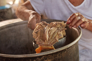 Documentary photography preparation of Oaxacan mole in Mexico, in a traditional way. Oaxacan tamales. Mexican food. Latin food. Spicy food.