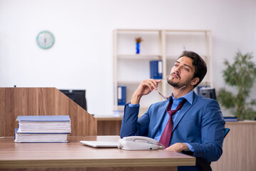 Young male employee working in the office