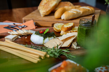 Burrata cheese with basil and pesto.