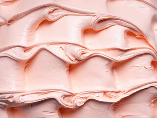 Frozen Peach flavour gelato - full frame detail. Close up of an orange- beige surface texture of...