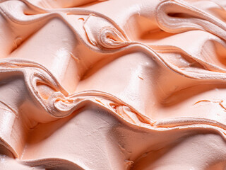 Frozen Peach flavour gelato - full frame detail. Close up of an orange- beige surface texture of...