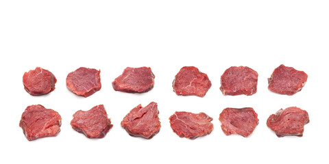 Juicy pieces of meat  isolated on white background. Rows raw Beef tenderloin (steaks). Red meat for grilling or barbecuing, copy space