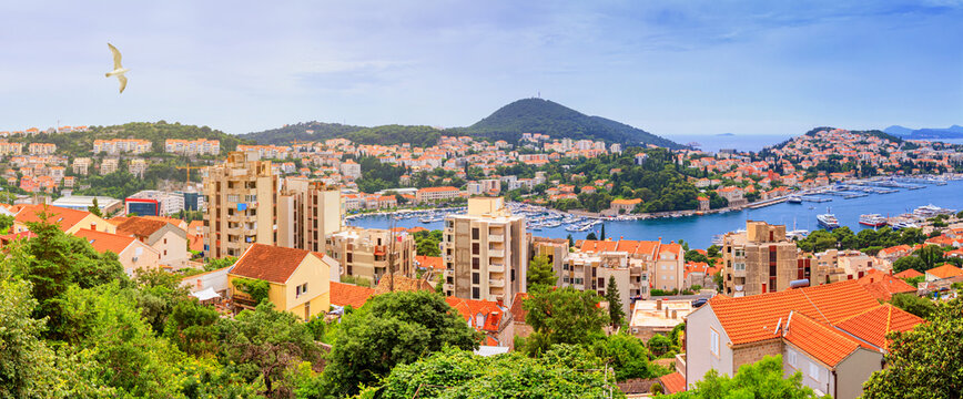 Coastal summer landscape, banner, panorama - top view of the port of Gruz of the town of Dubrovnik on the Adriatic coast of Croatia