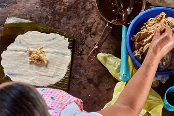 Documentary photography preparation of Oaxacan mole in Mexico, in a traditional way. Oaxacan tamales. Mexican food. Latin food. Spicy food.