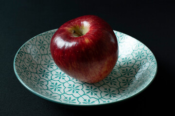 red apple on a plate