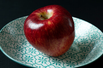 red apple on plate