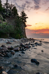 Baltic sea coast, beach and cliffs at Gdynia Orlowo during sunrise, Poland