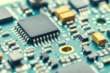 Electronic board with processors and microchips close-up, soft focus