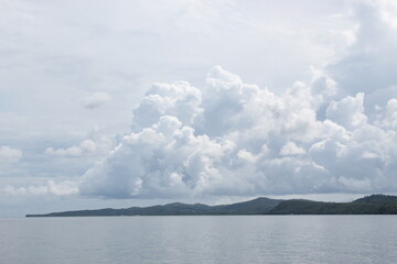 Naklejka na ściany i meble clouds over the lake