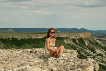 Young girl posing in the open air. Day. Summer.