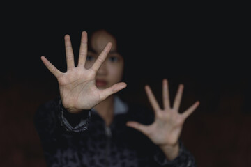 Kid girl showing hand signaling to stop useful to campaign against violence and pain. Stop abusing , terrified , A fearful child, human rights