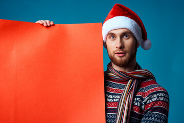 Cheerful man in a christmas Orange mockup Poster studio posing