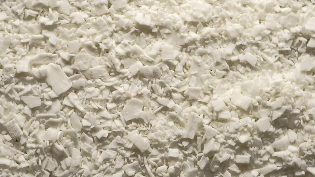 Soy wax for making candles. Circular motion. Candle making hobby.