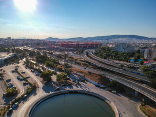 Vehicles elevating one of the most complex roads in Athens, the famous road junction at Faliro, Piraeus. Aerial view over Attica - Greece