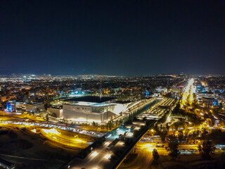 Aerial cityscape view of southern Athens at night.