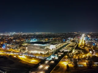 Gardinen Aerial cityscape view of southern Athens at night. © panosk18