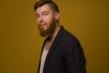 bearded man fashionable hairstyle jacket posing self confidence