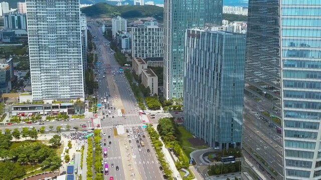 Aerial view of skyscraper buildings and street in the city. Songdo, South Korea. 인천, 송도 신도시, 빌딩, 주거, 아파트.