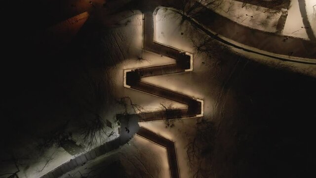 Aerial view from the drone to the forester at night in winter