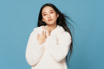 pretty woman asian appearance cosmetics on face winter clothing fashion