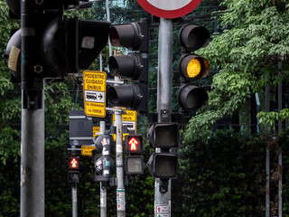Sao Paulo, Brazil, October 18, 2021. row of pedestrians traffic light semaphore on avenue in Sao...