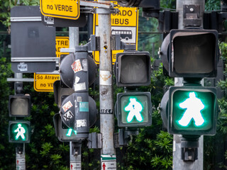 Sao Paulo, Brazil, October 18, 2021. row of pedestrians traffic light semaphore on avenue in Sao...