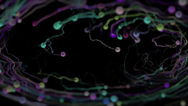 Many colorful balls rotate counterclockwise against a black background, dragging streams of paint behind them like tails. Abstract splash.