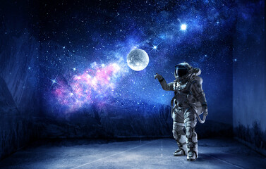 Fototapeta premium Astronaut at spacewalk . Mixed media