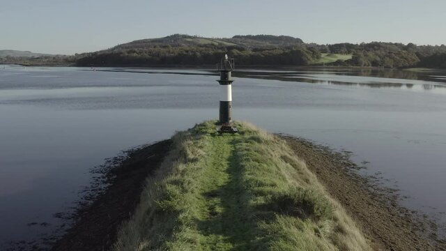Quaint picnic spot at lighthouse on River Suir island, Waterford, IRL