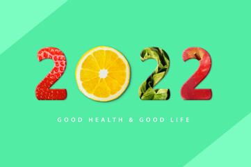 2022 Happy New Year for healthcare. Fruit and vegetables which make 2022 number. strawberry, orange, apple.