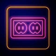 Glowing neon Electrical outlet icon isolated on black background. Power socket. Rosette symbol. Vector