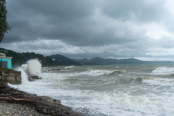 storm on the black sea, waves crashing on the shore, brown water