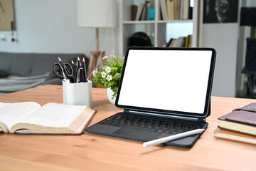 Fototapeta premium Mock up digital tablet with wireless keyboard on wooden table.