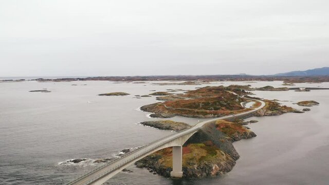Aerial view of Storseisundet Bridge surrounded by sea and islets, Atlantic Road, More og Romsdal county, Norway, Scandinavia, Europe - drone shot