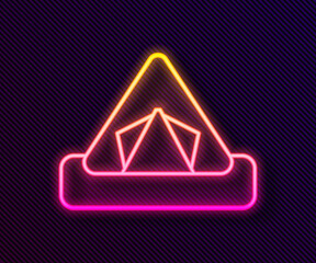 Glowing neon line Tourist tent icon isolated on black background. Camping symbol. Vector