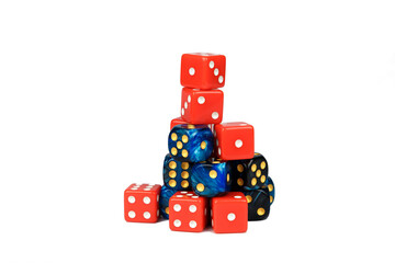 Dice of red and blue color stacked in the shape of a mountain.