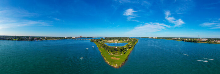 Looking towards the East, this aerial panoramic view shows the Western tip of Belle Isle below while showing Windsor, Ontario on the right and Detroit, Michigan on the left. 