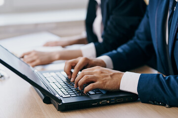 managers in the office in front of a laptop career network technologies