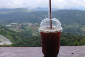 Iced americano coffee on table and blurred background
