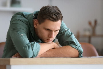 Obraz premium Depressed young man at home