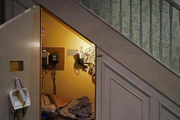 Fototapeta premium Interior design and decoration of Harry Potter's bedroom, the cupboard under the stairs-The making of Harry Potter at Warner bros studio tour London, United Kingdom