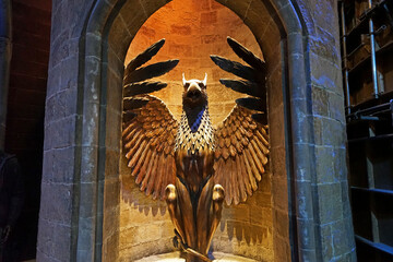 Obraz premium The phoenix statue stairs at the entrance gate to Dumbledore Hogwarts Headmaster's office at the warner bros studio tour London - The making of Harry Potter- Leavesden, United Kingdom