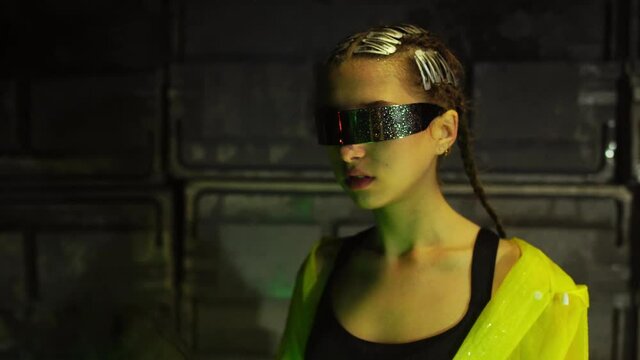 Cyberpunk future. World of tomorrow. Female cyborg walks through night street and shows id pass or passport document to worker with radioactive barrel. Science fiction scene, fantasy, sci. Rain
