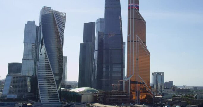 Moscow city glass skyscrapers. Famous Moscow International Business Center. Drone shot flying over Moscow skyscrapers. Aerial view of modern city. Business buildings. Office business buildings.
