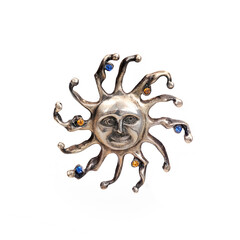 Silver brooch sun with colored gemstones isolated on white background