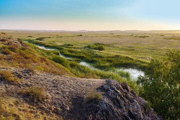Morning summer landscape with a steppe river. Bolshaya Karaganka river near Arkaim village, Russia