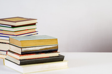 Stack of old books on white background