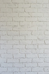 Decorative plaster on the wall in the form of white brickwork can be used as a background