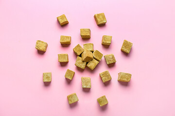 Tasty hojicha marshmallows on pink background